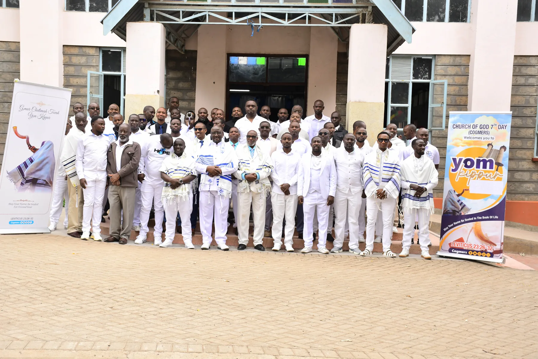 COGMEA members gathered outside the church