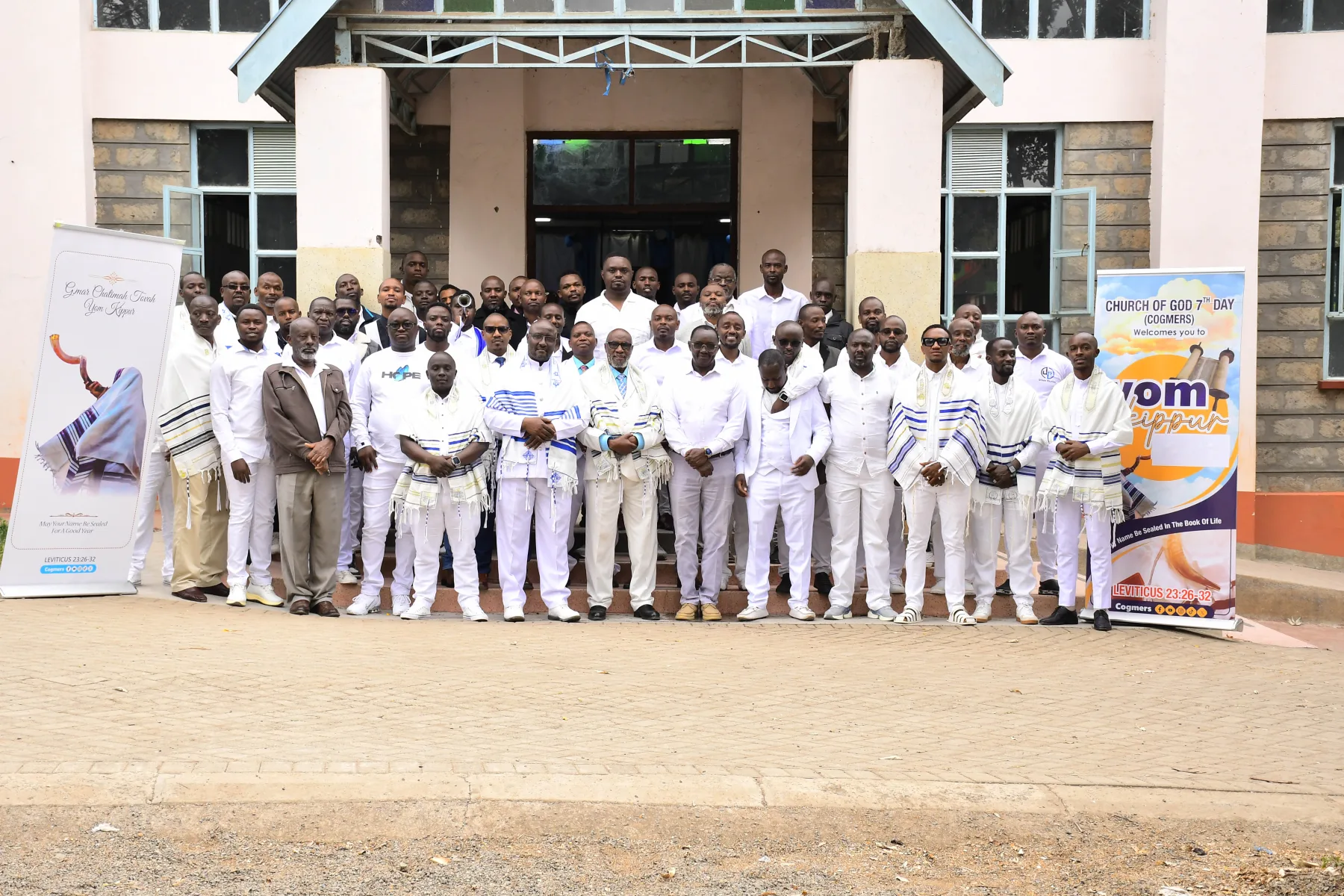 COGMEA members standing together after worship